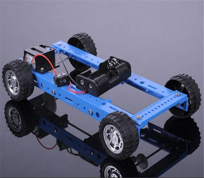Blue car chassis with wheels on a reflective surface