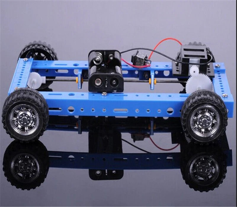Robot chassis with wheels and electronic components on a reflective surface