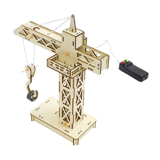 Wooden model crane with an intricate lattice design, featuring a movable arm and hook, this Crane Tower STEM Kit offers an educational DIY experience. It includes a small black remote control with red and green buttons for operating the crane, set on a rectangular base.